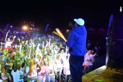 mc handing out glow sticks at glow party